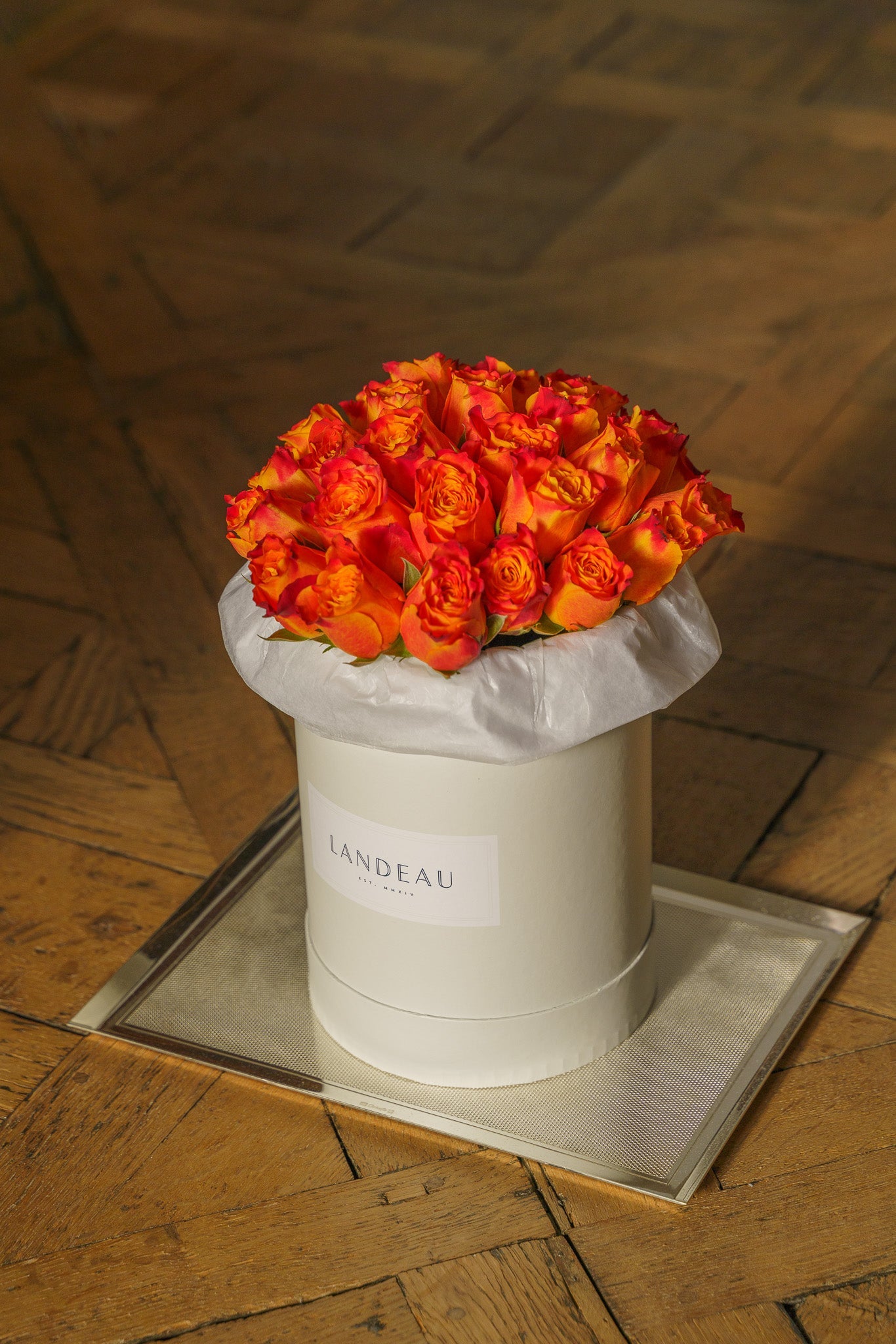 Luxury orange rose bouquet arranged in signature box